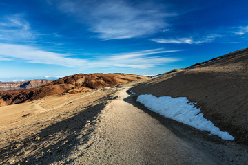 Teide National Park, Tenerife, Canary Islands - colourful soil of the Montana Blanca volcanic ascent trail. This scenic hiking path leads up to the 3718 m Teide Peak, the highest peak in Spain