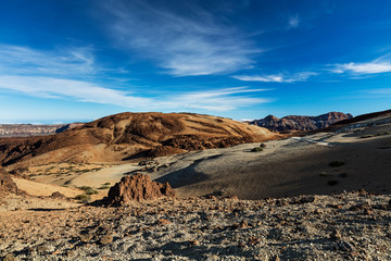 Teide National Park, Tenerife, Canary Islands - colourful soil of the Montana Blanca volcanic ascent trail. This scenic hiking path leads up to the 3718 m Teide Peak, the highest peak in Spain