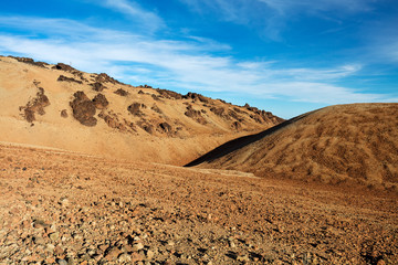 Teide National Park, Tenerife, Canary Islands - colourful soil of the Montana Blanca volcanic ascent trail. This scenic hiking path leads up to the 3718 m Teide Peak, the highest peak in Spain