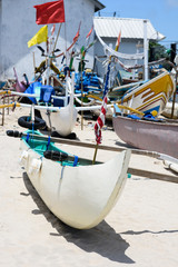 Fototapeta na wymiar Exotic travel destinations.Traditional balinese boats, white sand beach.