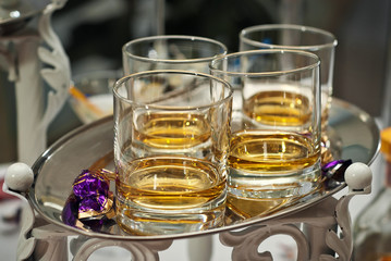 Glass glasses with colored drinks on the table