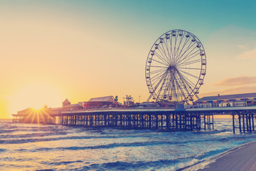 RETRO PHOTO FILTER EFFECT: Blackpool Central Pier at Sunset with Ferris Wheel, Lancashire, England...