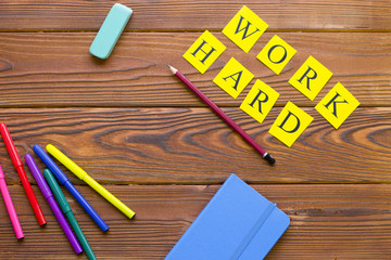 Work hard inscription on a rustic wooden background