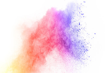 abstract multicolored powder splatted on white background,Freeze motion of color powder exploding.