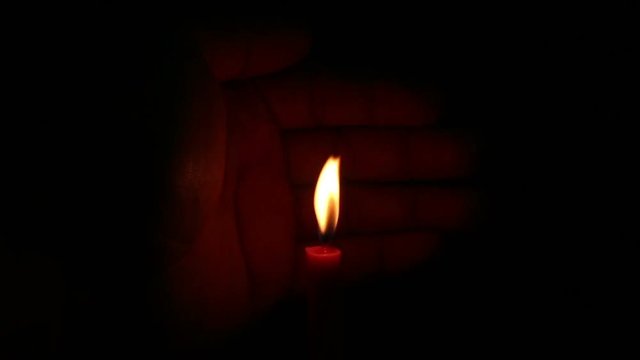 candle light on isolated black