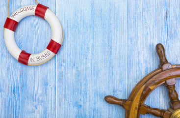 Maritime background with helm and lifebuoy © eyewave