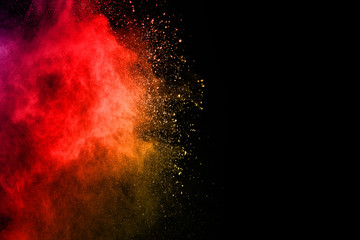 abstract powder splatted background. Colorful powder explosion on black background. Colored cloud. Colorful dust explode. Paint Holi. © kitsana
