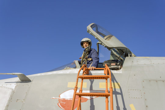 Military pilot in the cockpit of a jet aircraft