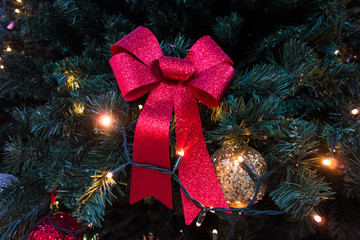 Red ribbon , and Golden Ball  on Christmas tree