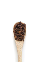 Cloves spices in wooden spoon isolated on white