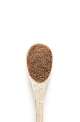 Ground nutmeg spices in wooden spoon isolated on white backgroun