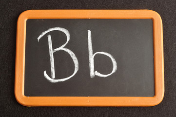 A black board with the alphabet letter B in a capital and small letter