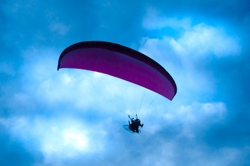 Botton up view of a paraglider flying