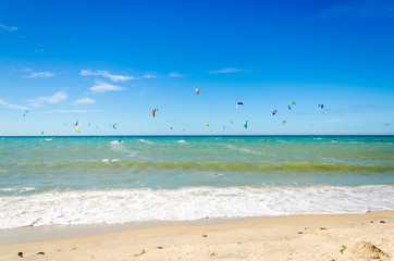 Fototapeta na wymiar A lot of kite surfers on the air in Cumbuco