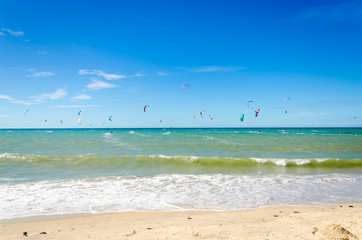 Fototapeta na wymiar Several kite surfing on the air at the Cumbuco