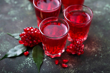 Glasses of fresh pomegranate juice.