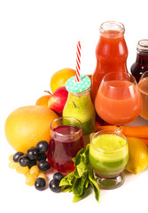 Glasses with fresh organic vegetable and fruit juices isolated on white.