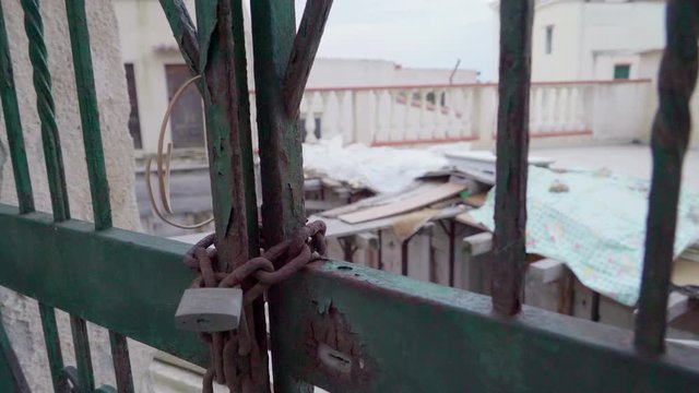 15924_The_rusty_chain_on_the_green_gate_of_the_house.mov