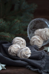 Homemade marshmallows or zephyr on the wooden background