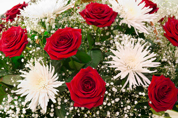 red roses and white chrysanthemums
