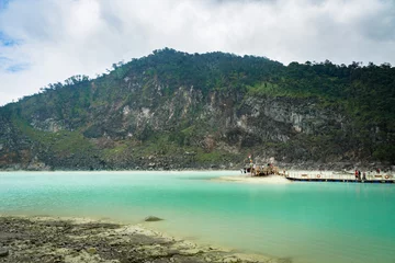 Foto op Canvas The view of Kawa Putih, "White Crater" in Bandung, West Java, Indonesia. White Crater is a natural wonder in Indonesia visited by domestic and foreign tourists. © uskarp2