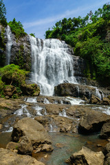 Fototapeta na wymiar Waterfall, countryside landscape in a village in Cianjur, Java, Indonesia