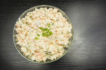 Bowl with vegetable salad prepared for the holiday. View from above.