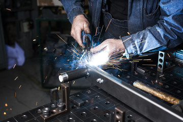 sparks of metal from a welding machine