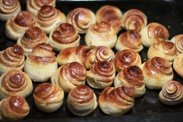 glossy buns with cinnamon in a baked oven