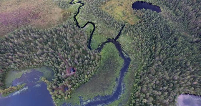 Following a river through finlands tundra and taiga moorland