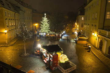 Fototapeta na wymiar Christmas Mood on the snowy night historical Island Kampa, Prague, Czech Republic