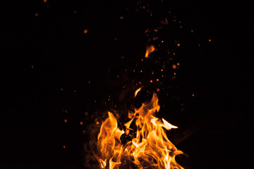 Fototapeta na wymiar fire spark fire black background