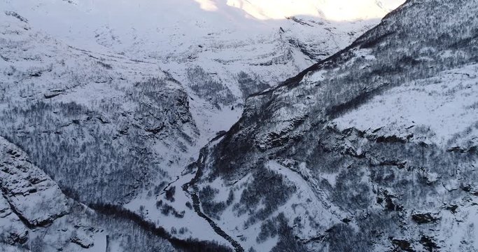 FLAM / AURLAND, NORWAY &ndash; FEBRUARY,2017 : Aerial shot of amazing landscape at sunset with snowy mountains and river in view