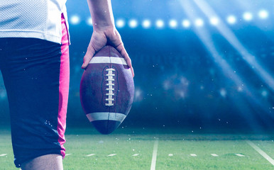 closeup rear view of young confident American football player