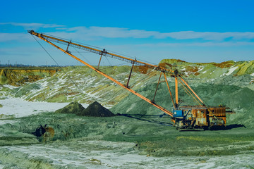 Excavators loaded manganese ore. Open development. Huge machines manganese ore is mined in open...