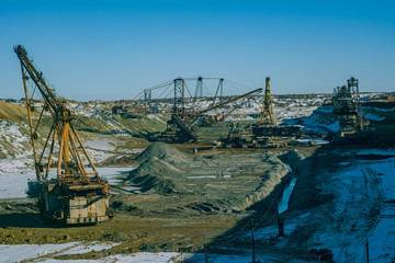 Production of manganese ore in the largest field in Europe. Open development. Huge machines of manganese ore mined in open pits. Metallurgical industry in Ukraine, Nikopol district.