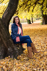 Portrait of an attractive young woman in a beautiful autumn woods