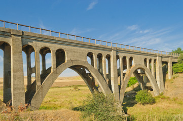 Fototapeta na wymiar Old concrete trestle style bridge in the Palouse area of Washington