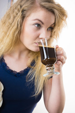 Positive woman drinking her morning coffee