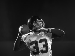 american football player throwing rugby ball