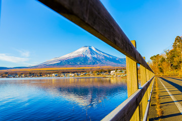 Mount Fuji and Lake Yamanaka. The foreground is a wood fence.Photo taken in Yamanakako Yamanashi Prefecture Japan.