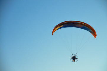 Paramotor flying on the sky