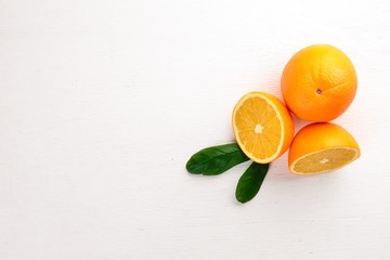 Orange on a wooden background. Top view. Free space for text.