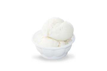 Fototapeta na wymiar Coconut ice cream in white plastic bowl isolated on white background with clipping path. Steamed coconut is made from coconut with a sweet aroma of fresh coconut.