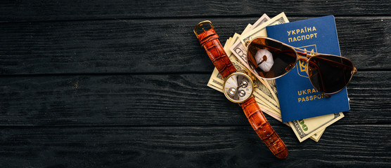 Fototapeta premium Business concept, American dollars, glasses, passport of a citizen of ukraine. Top view. Free space for text.