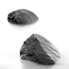 Monochrome black & white shore sea water and stones on the Orlowo beach in Gdynia, Tricity, Poland