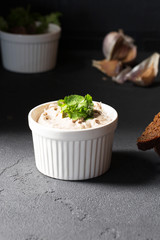 Mousse of mackerel, bowl, vertical, black background
