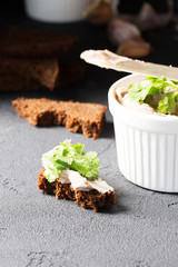 Mousse of mackerel, bowl, vertical, black background