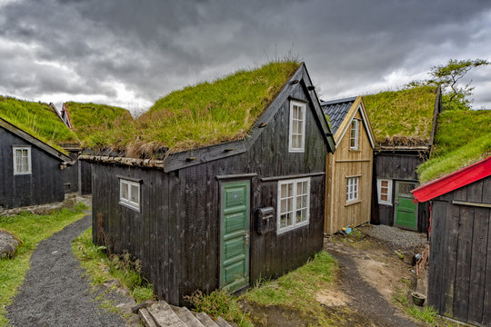 Far oer island wood grass roof house