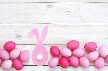 Obraz na płótnie Canvas Pink Easter eggs with rabbit